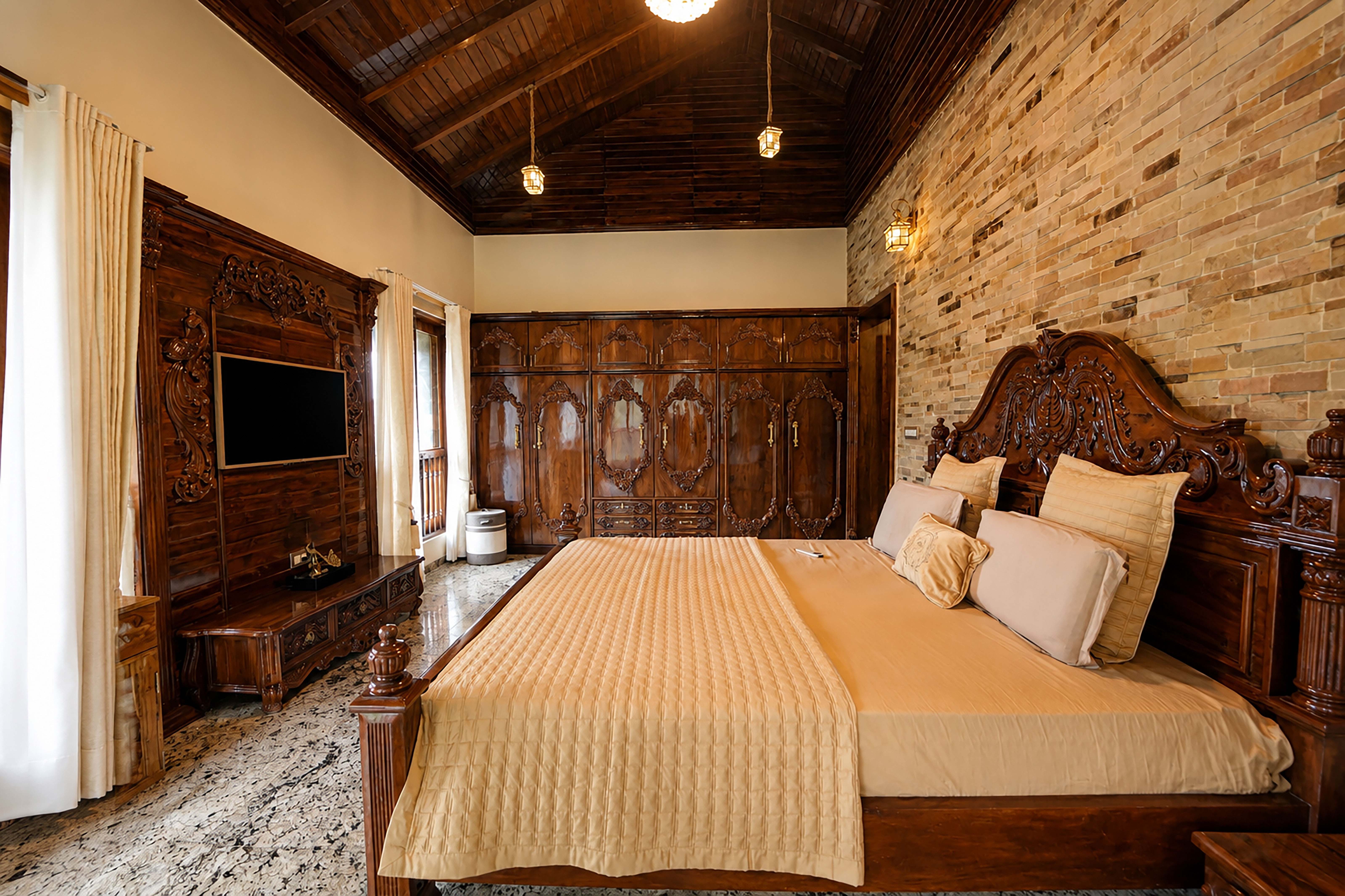Bedroom with wood-panelled television unit